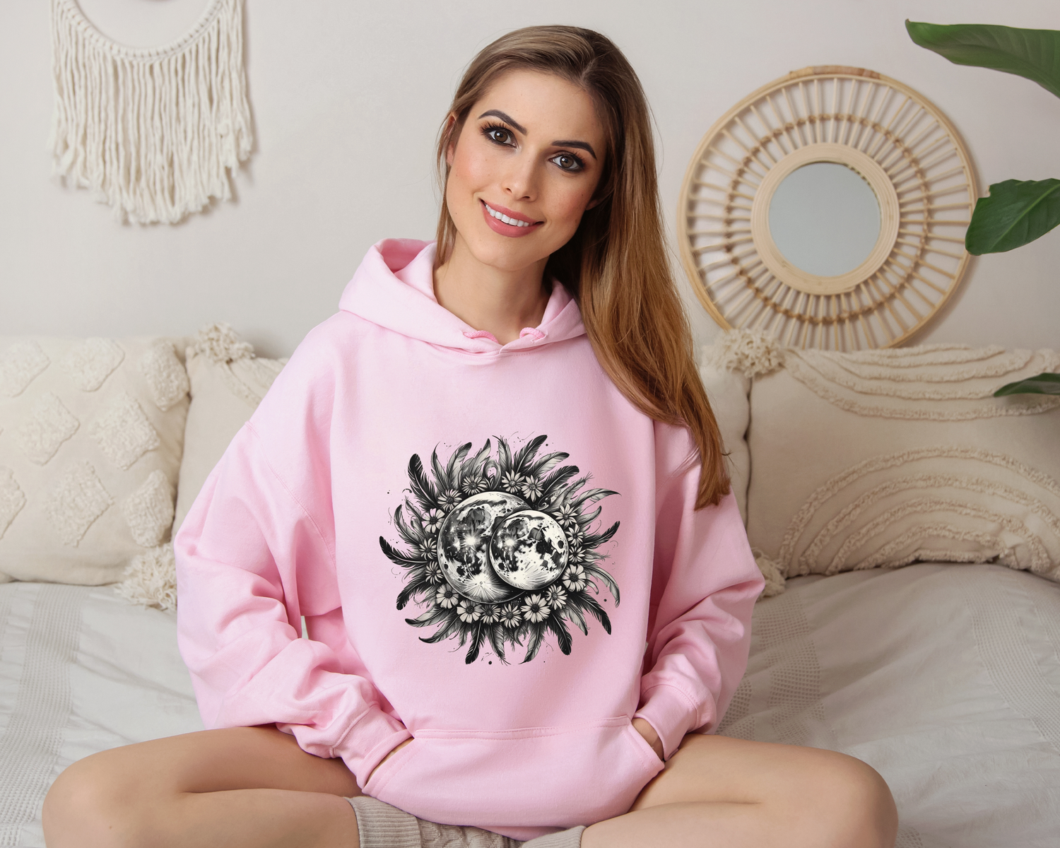 Celebrate the mystery of the night sky with the Twin Moons Hoodie, featuring two radiant moons embraced by a halo of feathers and wildflowers. This enchanting design blends celestial beauty with natural elegance, creating the perfect statement piece for dreamers, stargazers, and lovers of mystical fashion.

Soft, cozy, and effortlessly stylish, this hoodie is ideal for moonlit walks, cozy nights under the stars, or simply carrying a little magic with you wherever you go.

- A must-have for fantasy lovers, c